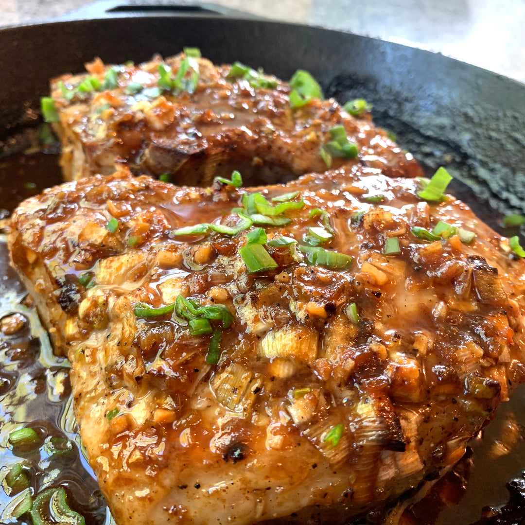 Finished pork dish in cast iron.