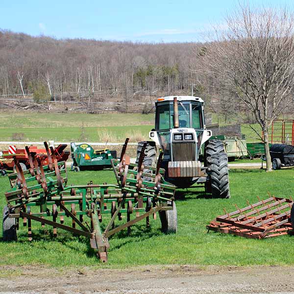 Equipment for sale at the dairy farm auction.