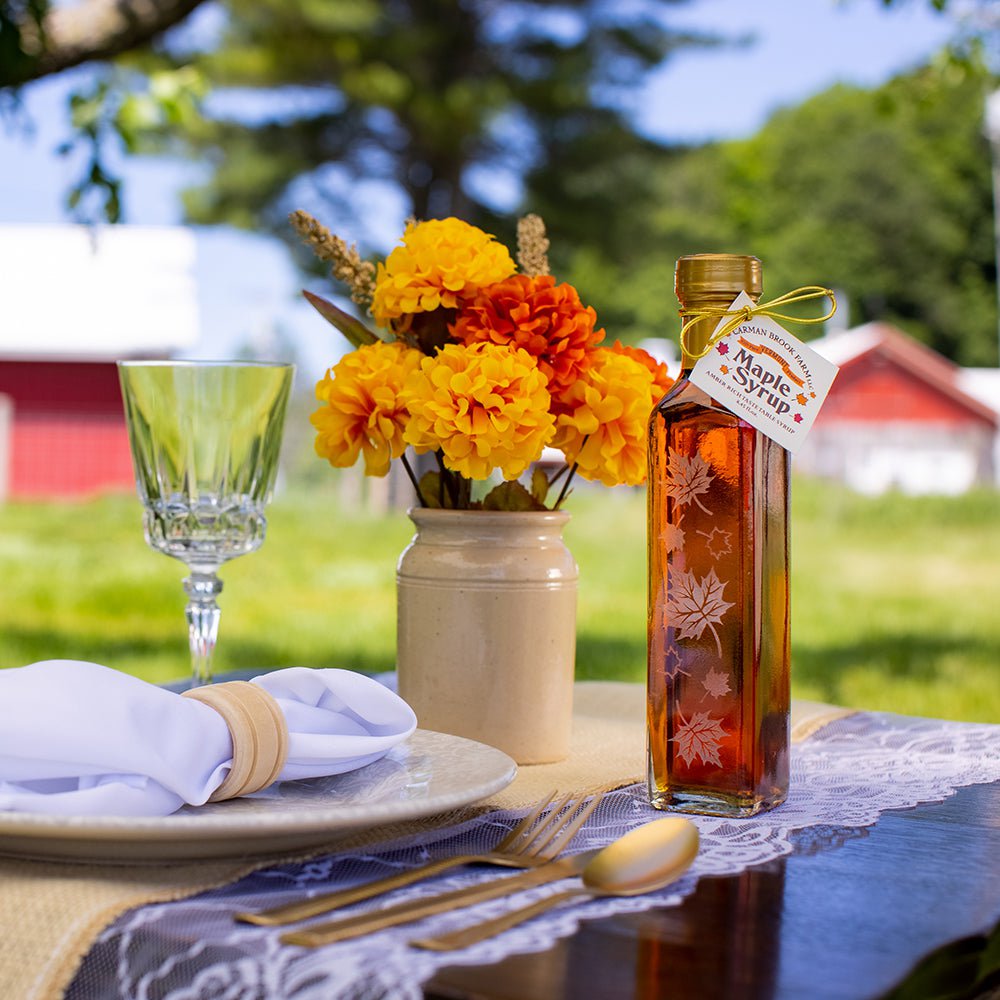 Fall wedding favor place setting featuring maple syrup.