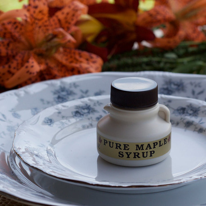 Small wedding favor bottle filled with Vermont Maple Syrup.